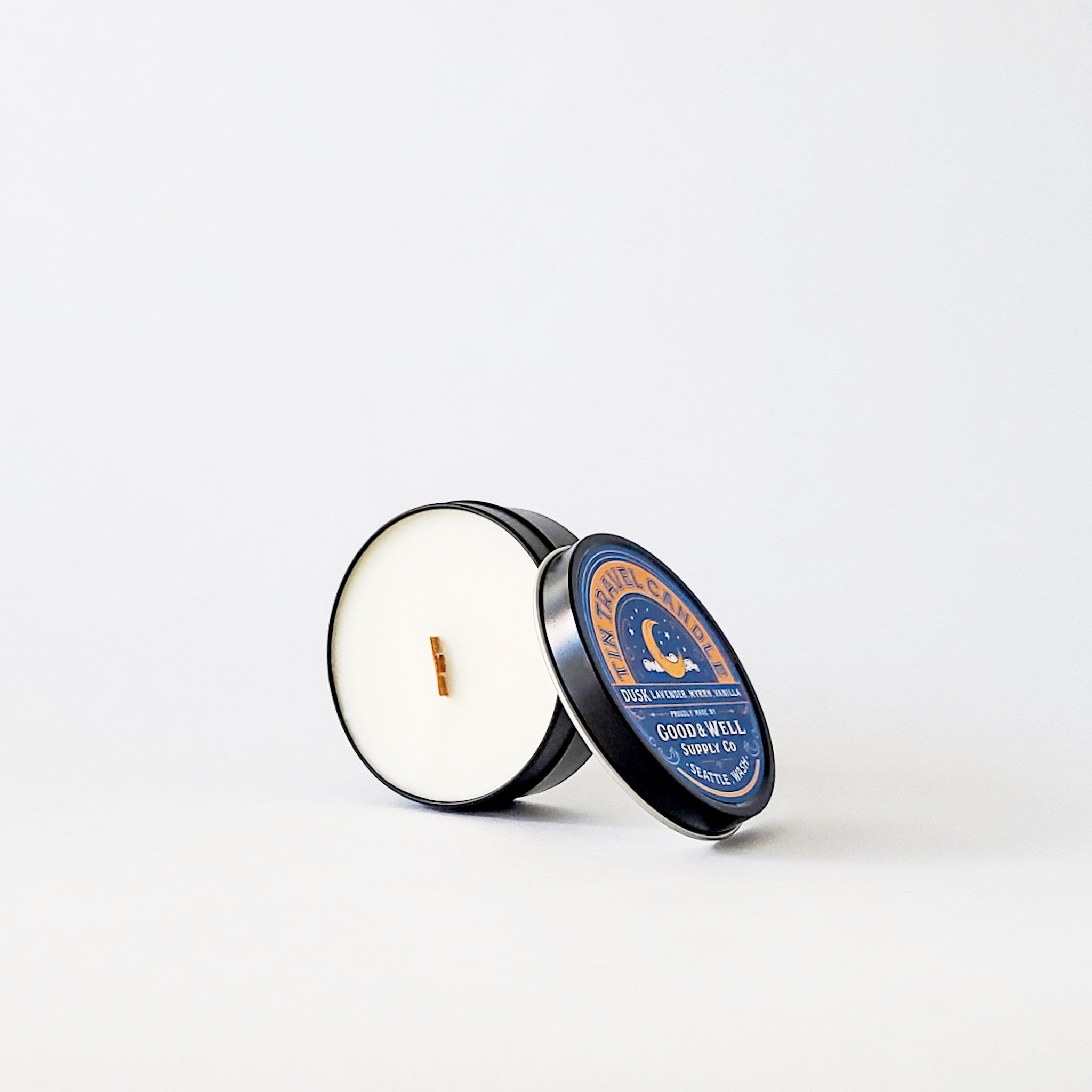 Travel tin candle with wooden wick made in Seattle, WA. Dusk Scent.