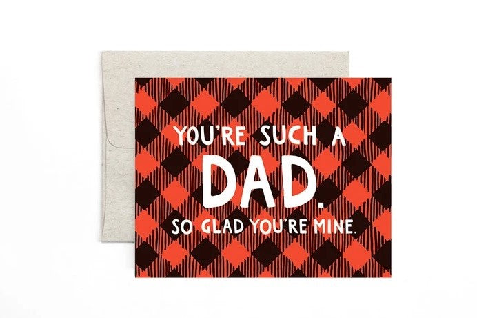 A horizontal card with a buffalo plaid black and red checkered background. In the foreground white text reads "You're such a Dad. So glad you're mine."