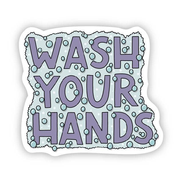 Purple text reading "wash your hands" surrounded with soap suds and bubbles.